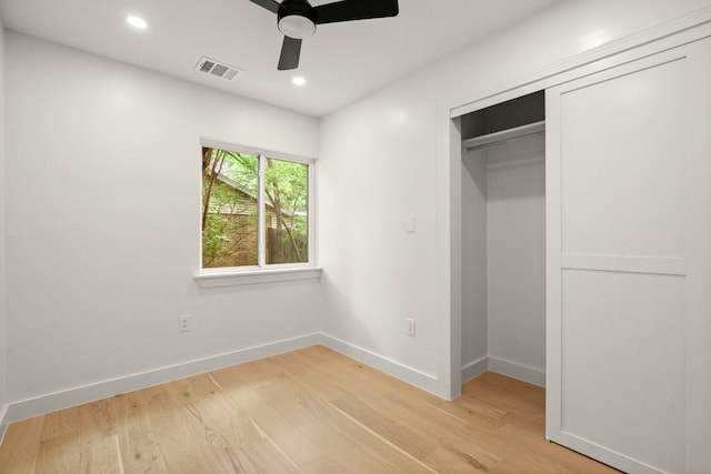 5406 Emerald Forest Dr, Austin, TX 78745 - unfurnished bedroom with visible vents, light wood-style flooring, baseboards, and a closet