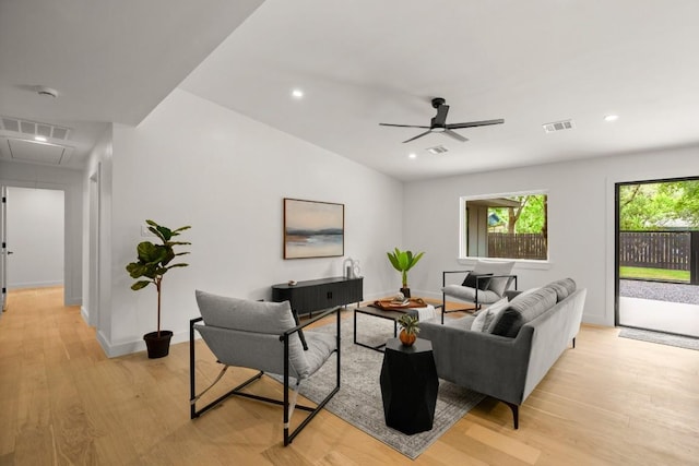 5406 Emerald Forest Dr, Austin, TX 78745 - living area with visible vents, attic access, light wood-style flooring, and a ceiling fan