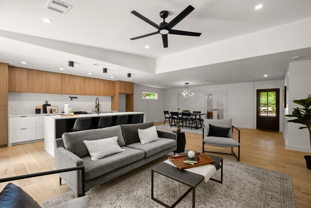 5406 Emerald Forest Dr, Austin, TX 78745 - living area with a healthy amount of sunlight, recessed lighting, and visible vents