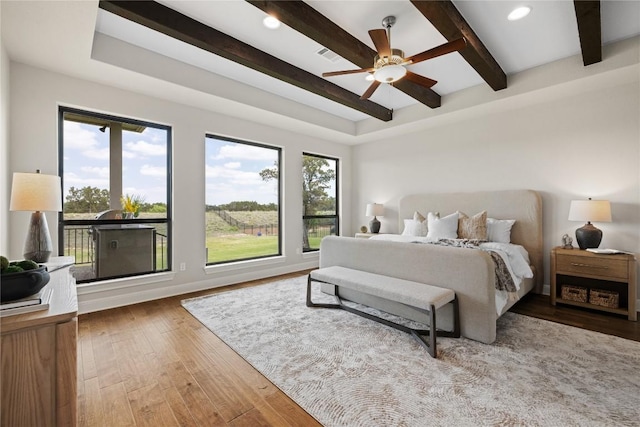2325 High Lonesome, Leander, TX 78641 - bedroom with beamed ceiling, wood finished floors, recessed lighting, and ceiling fan