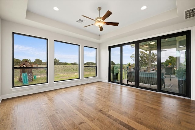 2325 High Lonesome, Leander, TX 78641 - spare room featuring ceiling fan, wood finished floors, a tray ceiling, recessed lighting, and french doors