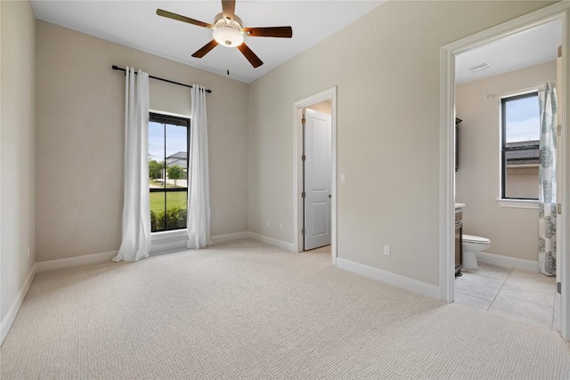 2325 High Lonesome, Leander, TX 78641 - unfurnished bedroom with multiple windows, light carpet, and ensuite bath