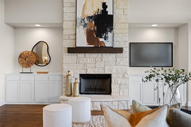 2325 High Lonesome, Leander, TX 78641 - living room with dark wood-type flooring, a stone fireplace, and recessed lighting