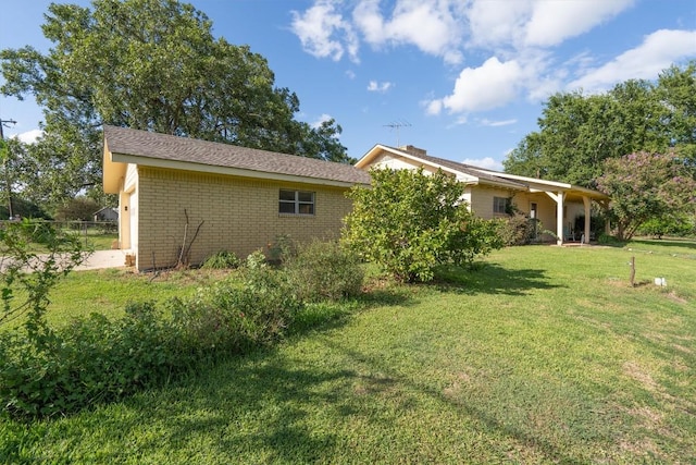 168 Bastrop St, Mcdade, TX 78650 - exterior space with a lawn and brick siding