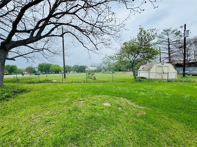 168 Bastrop St, Mcdade, TX 78650 - view of yard with fence, an outbuilding, and a storage shed