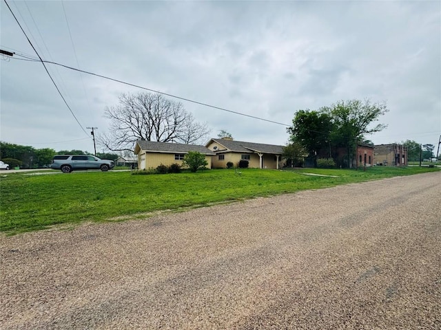 168 Bastrop St, Mcdade, TX 78650 - ranch-style house featuring a front yard