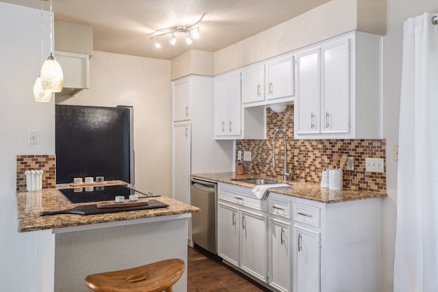 5604 Woodrow Ave Unit 7, Austin, TX 78756 - kitchen with black appliances, decorative backsplash, white cabinets, stone counters, and dark wood-style floors