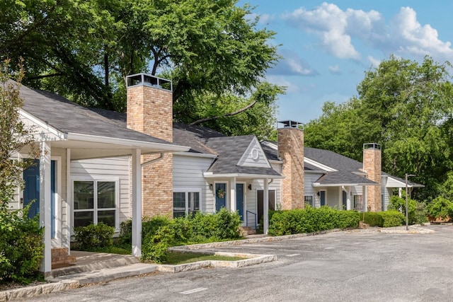 5604 Woodrow Ave Unit 7, Austin, TX 78756 - view of front facade featuring a chimney