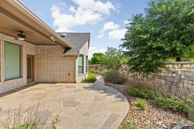 217 Monahans Dr, Georgetown, TX 78628 - fenced backyard with ceiling fan and a patio
