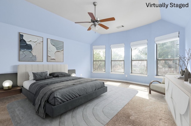 217 Monahans Dr, Georgetown, TX 78628 - carpeted bedroom featuring lofted ceiling, multiple windows, and ceiling fan