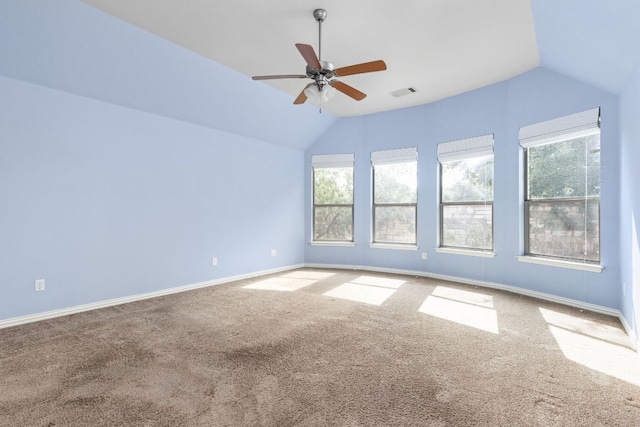 217 Monahans Dr, Georgetown, TX 78628 - carpeted empty room with vaulted ceiling, plenty of natural light, and a ceiling fan