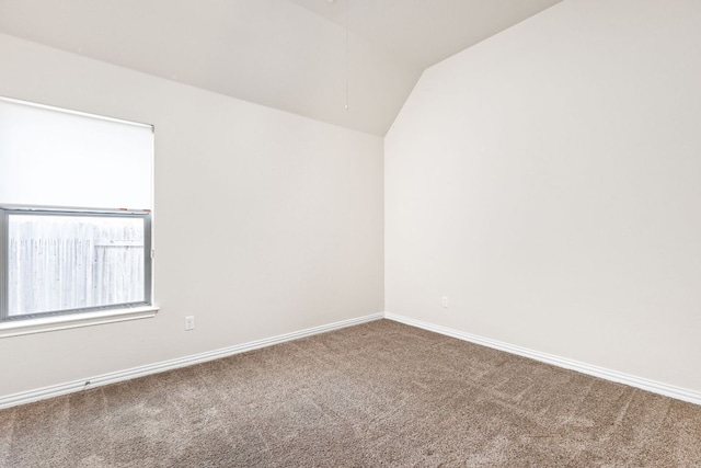 217 Monahans Dr, Georgetown, TX 78628 - carpeted empty room featuring lofted ceiling and attic access