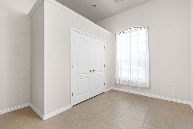 217 Monahans Dr, Georgetown, TX 78628 - unfurnished bedroom with baseboards and light tile patterned floors