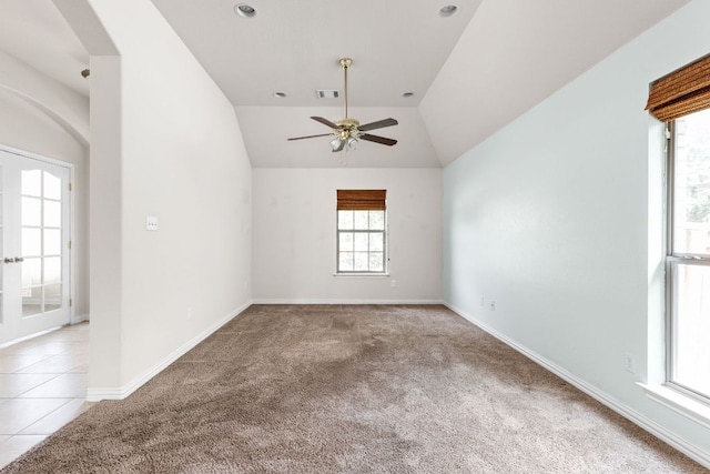 217 Monahans Dr, Georgetown, TX 78628 - spare room with light colored carpet, vaulted ceiling, ceiling fan, and arched walkways
