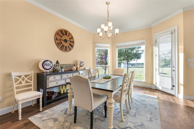 2560 Square Nail Cv, Leander, TX 78641 - dining area featuring crown molding, a chandelier, wood finished floors, and baseboards