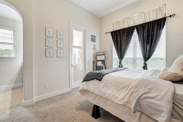 2560 Square Nail Cv, Leander, TX 78641 - bedroom featuring arched walkways and light carpet
