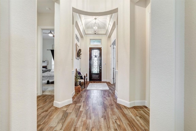 2560 Square Nail Cv, Leander, TX 78641 - entrance foyer featuring crown molding, wood finished floors, and a chandelier