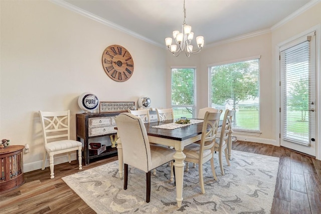 2560 Square Nail Cv, Leander, TX 78641 - dining room with crown molding, a chandelier, and wood finished floors