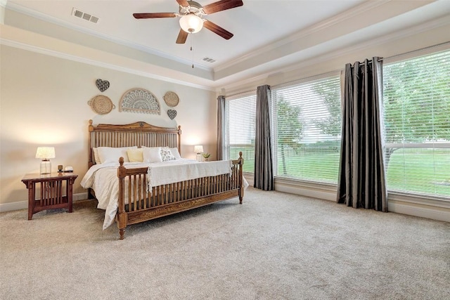 2560 Square Nail Cv, Leander, TX 78641 - carpeted bedroom with crown molding, multiple windows, a tray ceiling, and ceiling fan