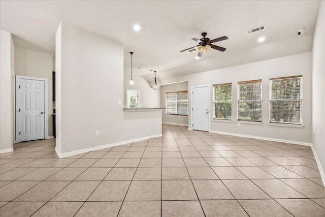 unfurnished living room with baseboards, a ceiling fan, visible vents, and recessed lighting