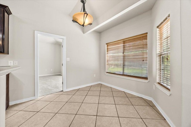 145 Moon Mist Dr, Bastrop, TX 78602 - unfurnished dining area featuring baseboards and light tile patterned flooring