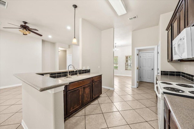 kitchen featuring ceiling fan, light tile patterned floors, a sink, and white appliances