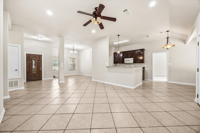 145 Moon Mist Dr, Bastrop, TX 78602 - unfurnished living room with ceiling fan, light tile patterned floors, recessed lighting, a chandelier, and vaulted ceiling