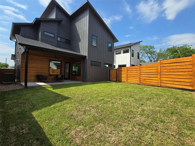 5303 Grover Ave Unit 1, Austin, TX 78756 - back of house featuring a patio, a fenced backyard, board and batten siding, and a ceiling fan