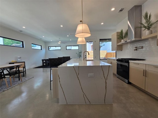 5303 Grover Ave Unit 1, Austin, TX 78756 - kitchen with black gas range oven, concrete flooring, backsplash, recessed lighting, and decorative light fixtures