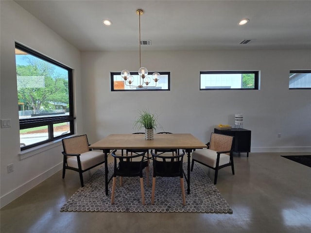 5303 Grover Ave Unit 1, Austin, TX 78756 - dining area with finished concrete floors, healthy amount of natural light, recessed lighting, and a chandelier