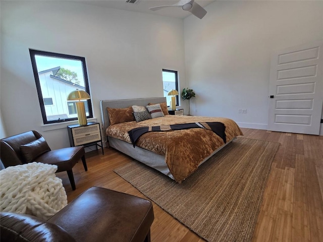 5303 Grover Ave Unit 1, Austin, TX 78756 - bedroom with a high ceiling, wood finished floors, and a ceiling fan