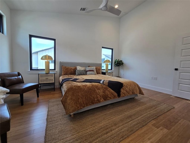 5303 Grover Ave Unit 1, Austin, TX 78756 - bedroom with multiple windows, wood finished floors, high vaulted ceiling, and ceiling fan
