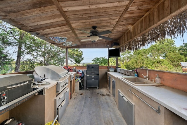 19206 Hornsby Ln, Spicewood, TX 78669 - view of patio with exterior kitchen and a ceiling fan