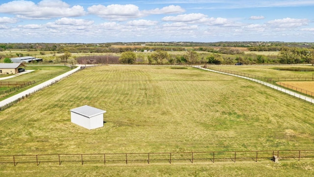 birds eye view of property featuring a rural view