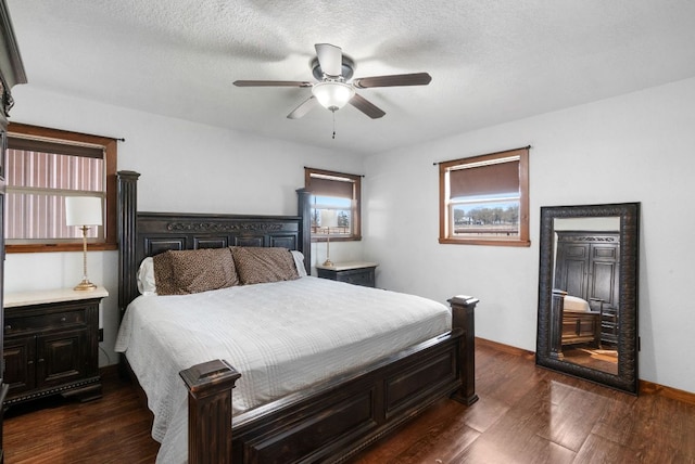 bedroom featuring ceiling fan and dark wood-style flooring