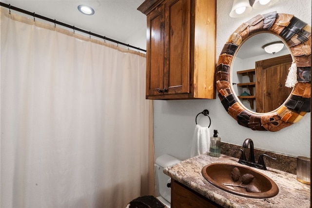 full bath with toilet and vanity
