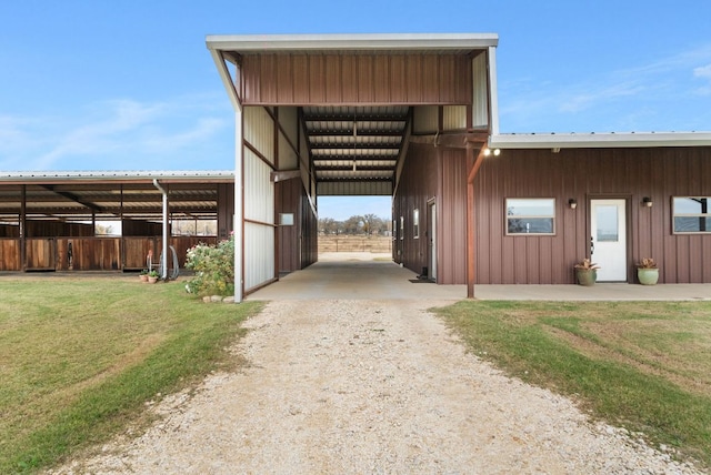 exterior space featuring an exterior structure, an outdoor structure, and driveway