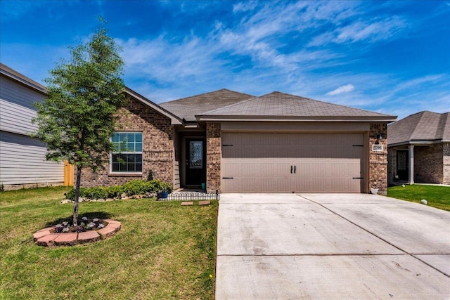 17216 Farmhouse Ln, Elgin, TX 78621 - single story home with a garage, driveway, brick siding, and a front lawn