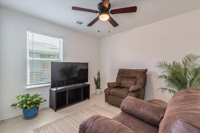 17216 Farmhouse Ln, Elgin, TX 78621 - living room with tile patterned flooring, baseboards, and ceiling fan