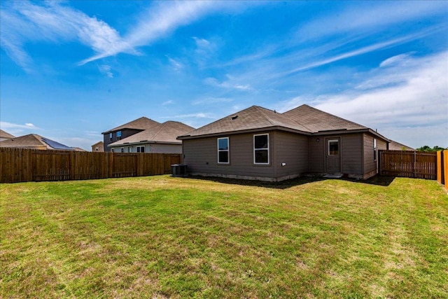 17216 Farmhouse Ln, Elgin, TX 78621 - rear view of house featuring central AC