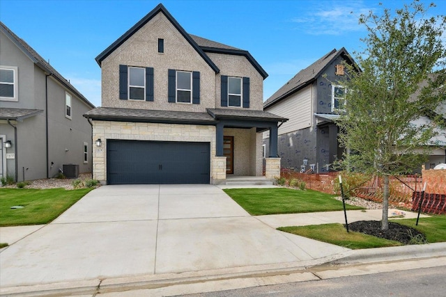 1404 S Brook Dr, Leander, TX 78641 - view of front of property featuring a garage, a front lawn, concrete driveway, central AC unit, and stone siding