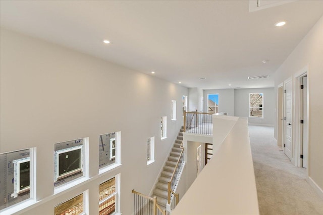 1404 S Brook Dr, Leander, TX 78641 - hallway with an upstairs landing, recessed lighting, light carpet, and baseboards