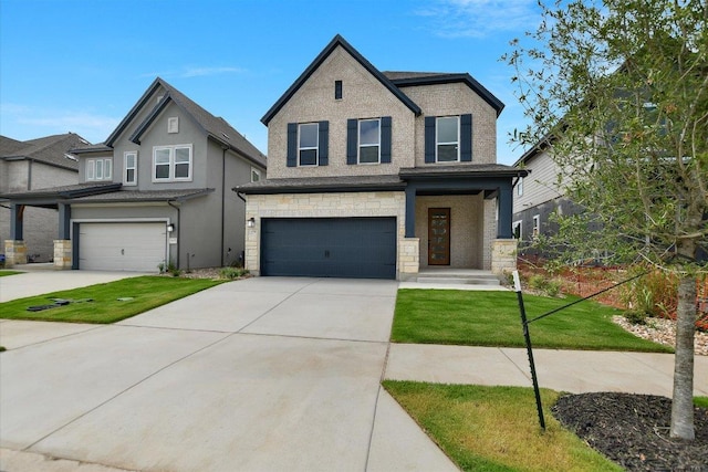 1404 S Brook Dr, Leander, TX 78641 - view of front of property featuring an attached garage, concrete driveway, a front lawn, and stone siding