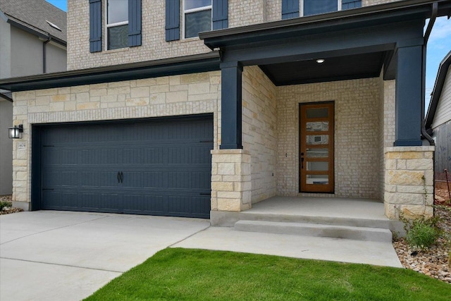 1404 S Brook Dr, Leander, TX 78641 - property entrance featuring a garage, driveway, and stone siding