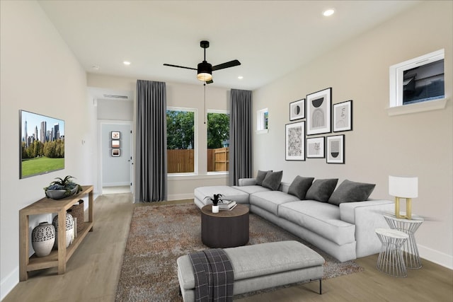1404 S Brook Dr, Leander, TX 78641 - living area with light wood-style floors, a ceiling fan, baseboards, and recessed lighting