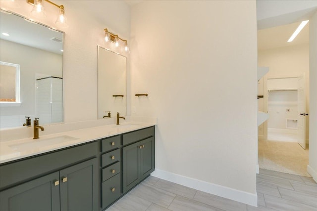 1404 S Brook Dr, Leander, TX 78641 - full bathroom featuring double vanity, an enclosed shower, baseboards, and tile patterned flooring