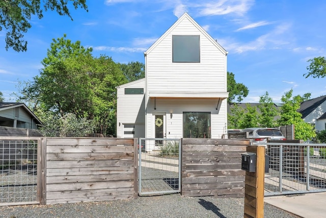 4614 Gillis St Unit 1, Austin, TX 78745 - view of front of home with a gate and a fenced front yard
