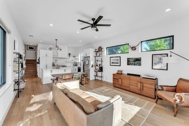 4614 Gillis St Unit 1, Austin, TX 78745 - living room featuring ceiling fan, a chandelier, light wood-type flooring, and recessed lighting