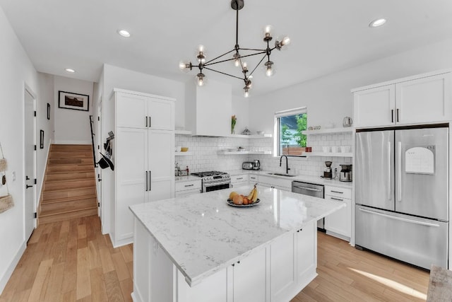 4614 Gillis St Unit 1, Austin, TX 78745 - kitchen with appliances with stainless steel finishes, open shelves, a sink, white cabinets, and recessed lighting