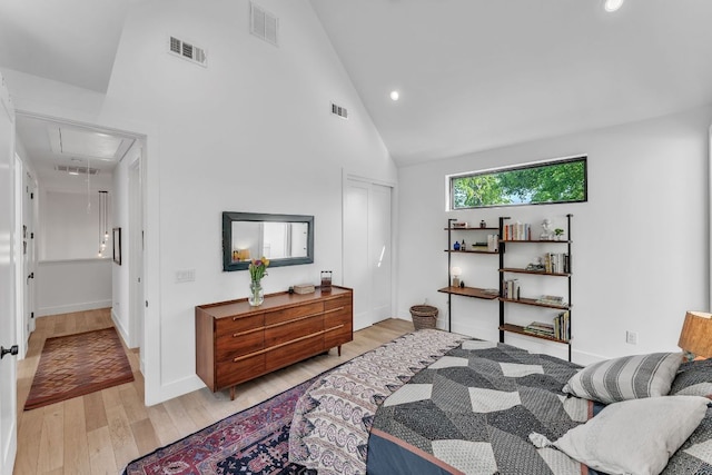 4614 Gillis St Unit 1, Austin, TX 78745 - bedroom featuring attic access, light wood finished floors, recessed lighting, high vaulted ceiling, and baseboards